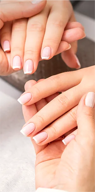 manicure master holds hands young woman showing finished manicure fingers nail salon